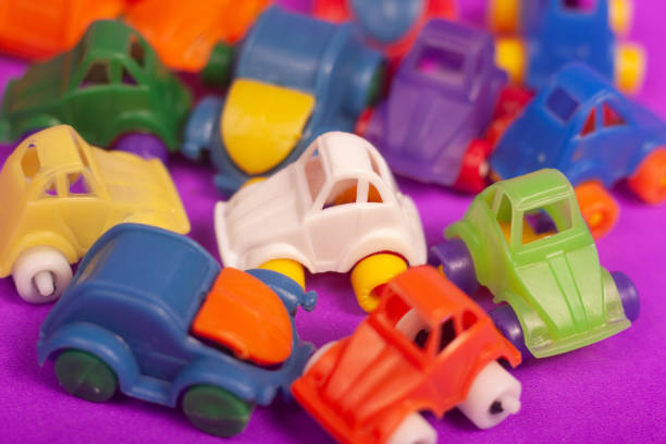 plastic cars toys colorful on a purple background