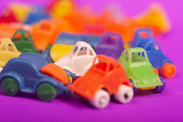 plastic cars toys colorful on a purple background