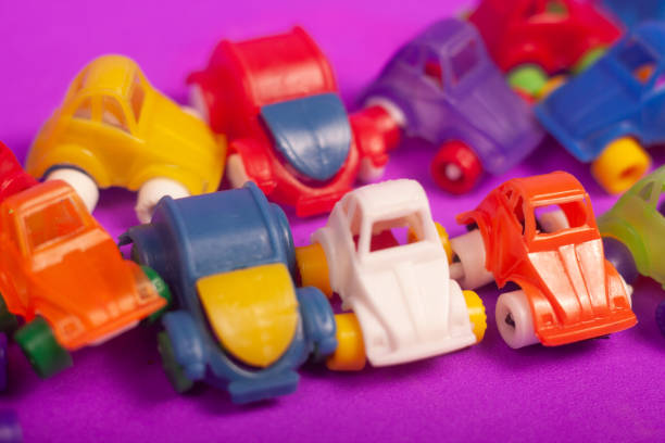plastic cars toys colorful on a purple background