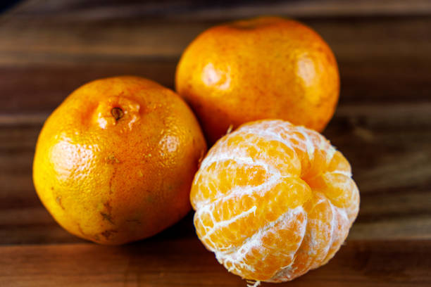 Tangerine slices on a plate isolated on a white background.