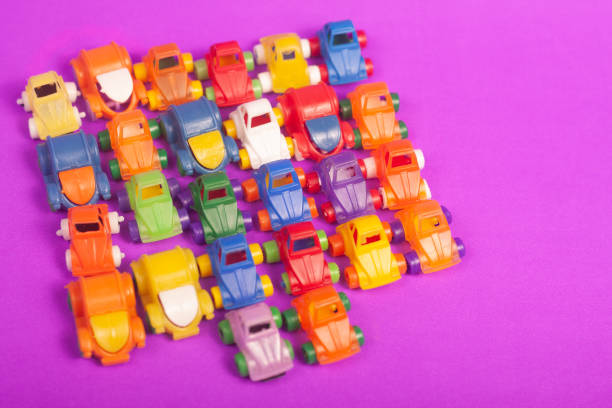 plastic cars toys colorful on a purple background
