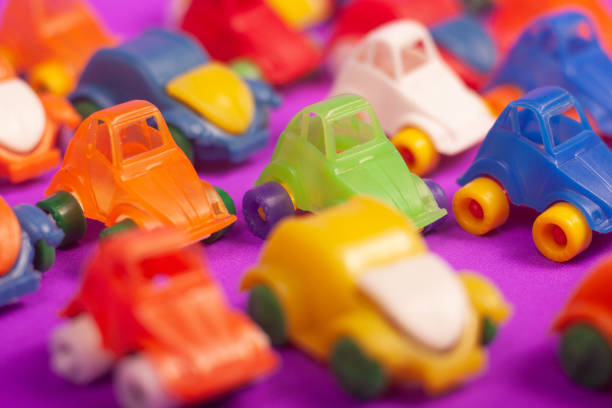 plastic cars toys colorful on a purple background