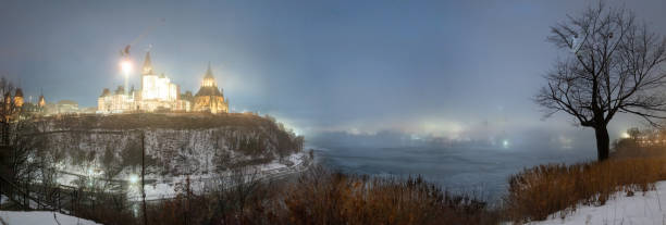 Parliament Hill in Ottawa, Ontario Canada with foggy conditions.