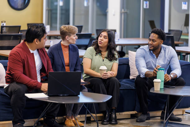 istock Sharing ideas on coffee break. Diverse office team in relaxed discussion in office 2192449307
