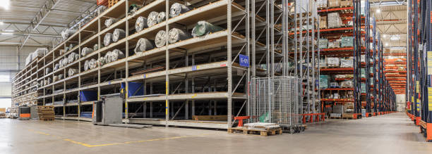istock A modern warehouse with many shelves for storing goods. Extra-large, high-resolution, stitched panorama. 2192449611