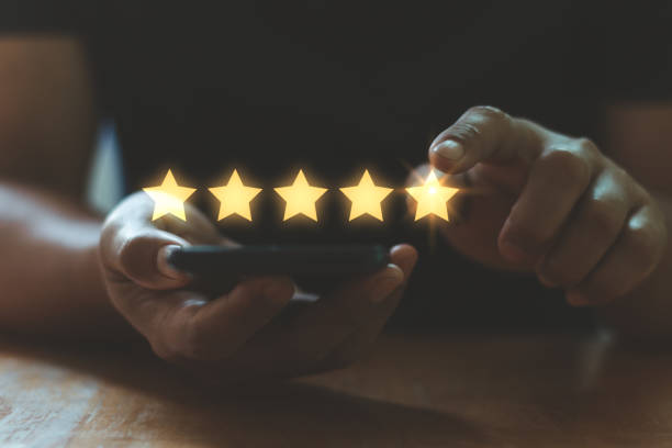 istock Customer service and Satisfaction concept. User give rating to service experience on a mobile smartphone app, rating service with five star for customer review satisfaction feedback survey technology. 2192449733