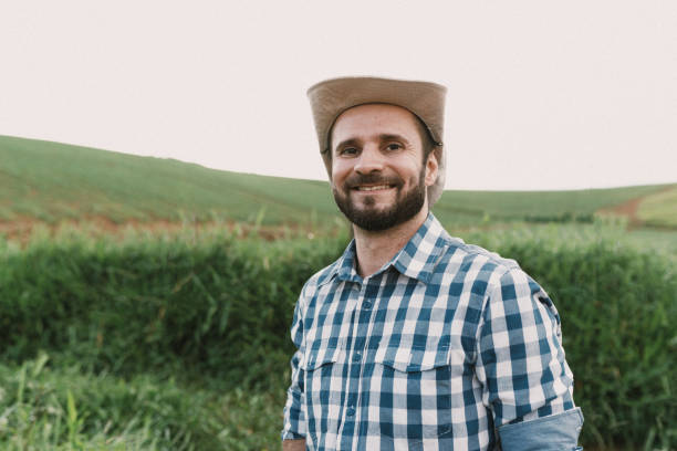 istock Smiling farmer in the plantation 2192453400