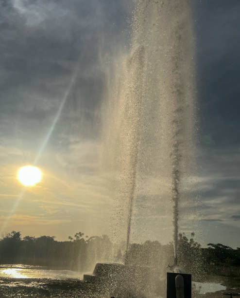 istock Water fountain that springs from the ground and explodes upwards 2192454575