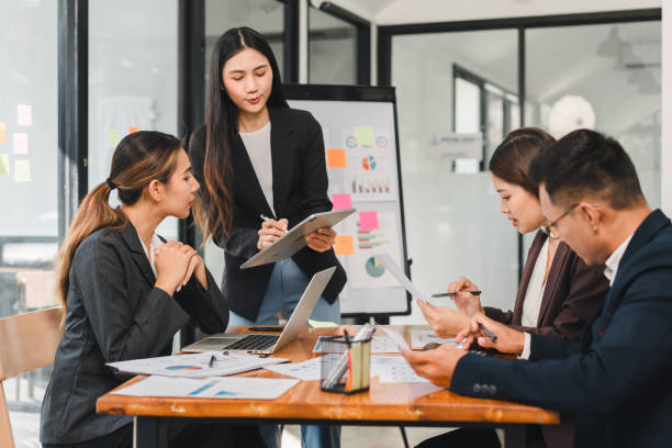 istock Efficient business meeting with professionals discussing strategies and analyzing data. team collaborates on charts and graphs, showcasing teamwork and productivity 2192455878
