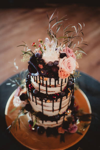 istock Top down wedding cake with flowers and chocolate drizzle 2192458048