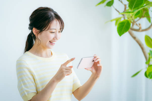 istock young woman calling on smartphone 2192461979