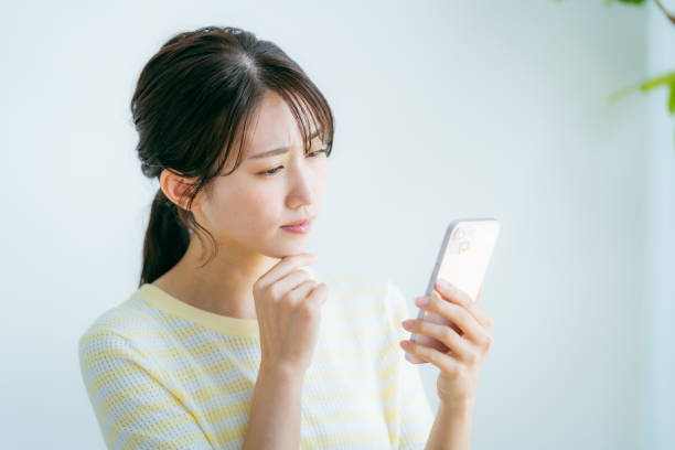 istock A woman operating a smartphone in the room 2192461986