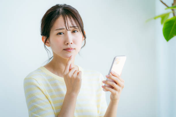 istock A woman operating a smartphone in the room 2192461989