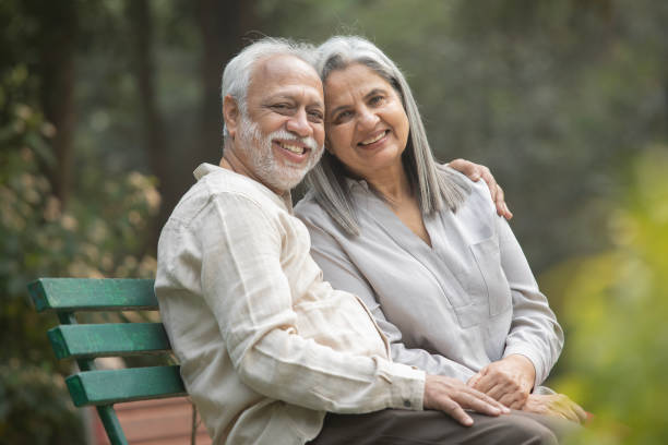 istock Romantic senior couple smiling and looking away 2192462819