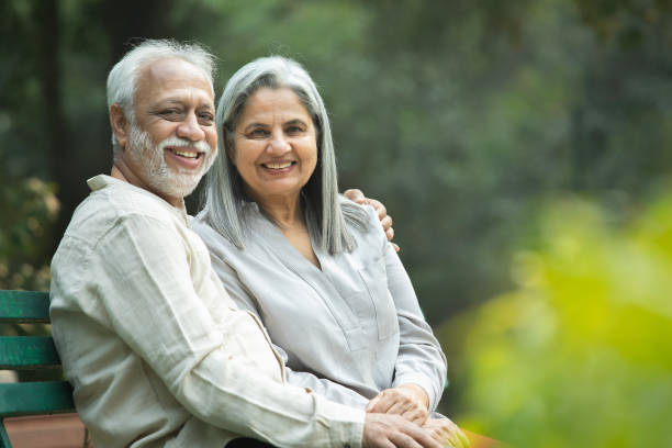 istock Romantic senior couple smiling and looking away 2192462823