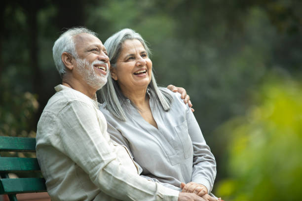 istock Romantic senior couple smiling and looking away 2192462836
