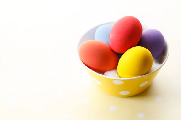 Top view of a yellow egg on a green cloth with natural light,