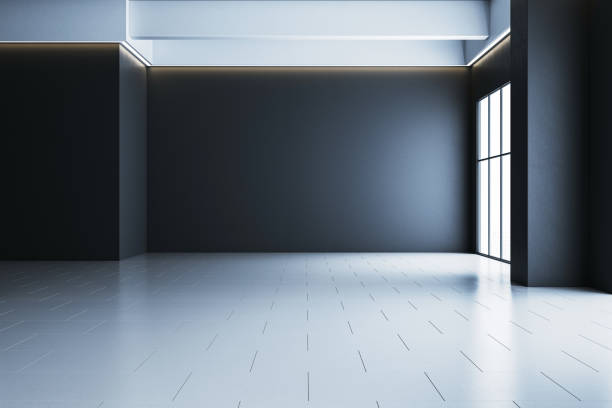 istock Modern empty interior space with large windows and gray walls illuminated by natural and artificial light. 3D Rendering 2192466456