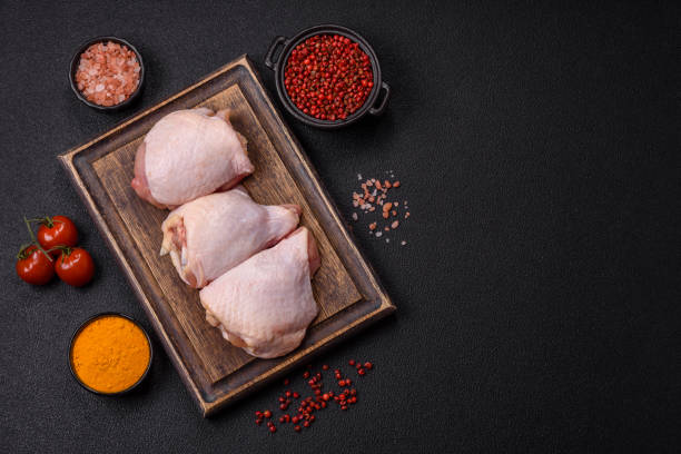 istock Fresh raw chicken thighs with salt and spices 2192466893