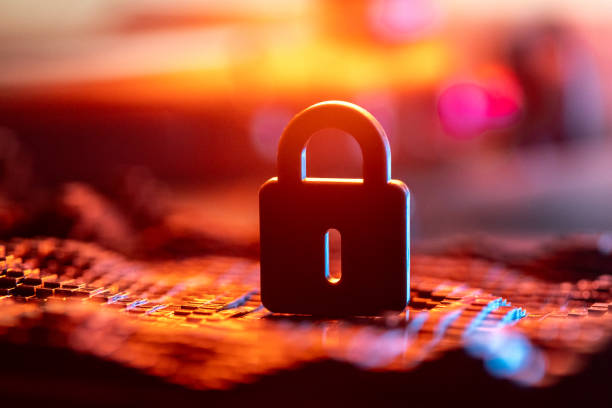 istock Close-Up of a Secure Lock over Blurred Digital Background in Warm Colors 2192467778