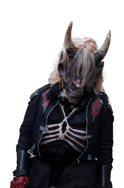 Demon Krampus isolated on white background.Christmas folklore character.Masquerade character in costume and mask.Demonic costumed character. cultural winter festival