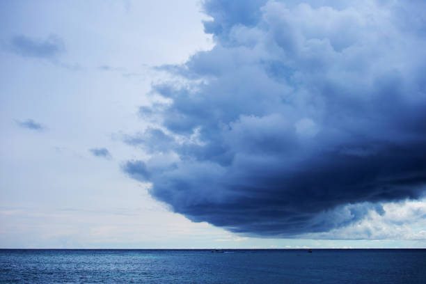 istock White cumulus clouds over sea close up blue sky 2192473323
