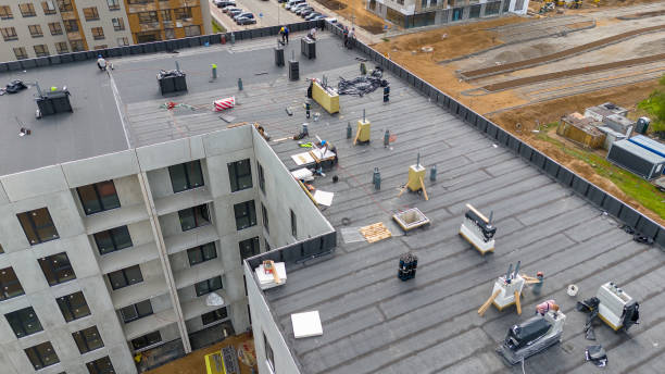 Aerial View of Construction Workers on Flat Roof