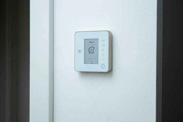 istock A modern electric thermostat control system on white wall . Air conditioning at home concept 2192476566