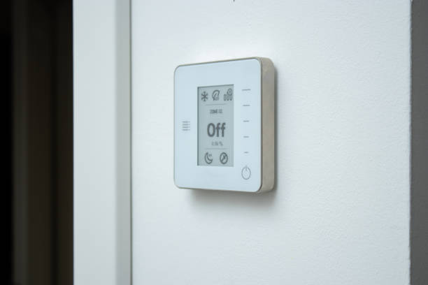 istock A modern electric thermostat control system on white wall . Air conditioning at home concept 2192476575