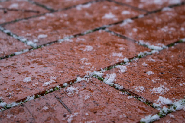 istock Snow covered red bricks path ground. Cold winter season concept 2192476592