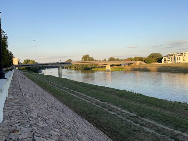 istock Scenic view of a river with a bridge spanning across it 2192477253