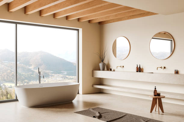 istock Modern bathroom interior with freestanding bathtub and double sinks, large window with mountain view, wooden ceiling, neutral tones. 3D Rendering 2192479149