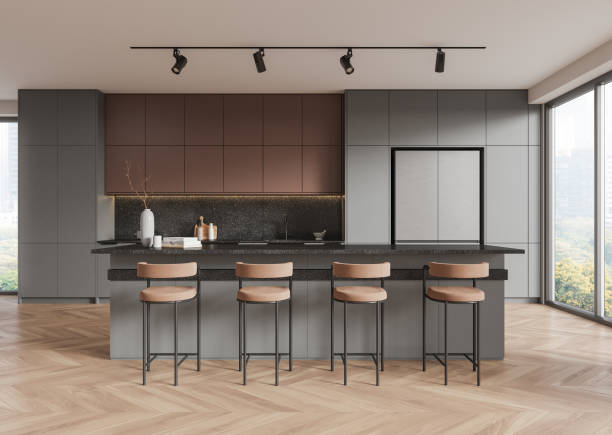 istock Stylish modern kitchen with bar stools, minimalist cabinets, and track lighting. Hardwood floor, large windows. 3D Rendering 2192479169