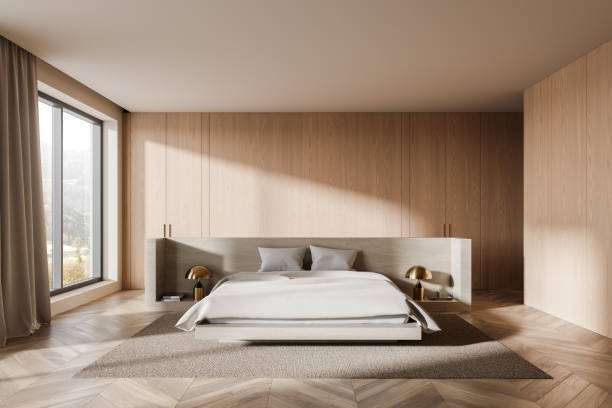 istock Modern minimalist bedroom interior design with natural wood elements and large window in contemporary home. 3D Rendering 2192479408