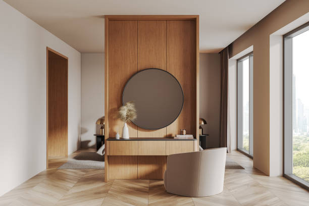 istock Modern interior with wooden panel and round mirror in bright room with large windows. 3D Rendering 2192479617