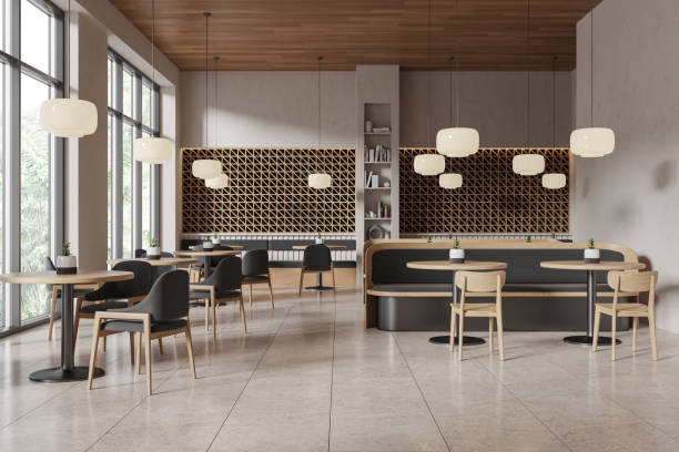 istock Modern cafe interior with wooden furniture, large windows, and elegant lighting. 3D Rendering 2192479913