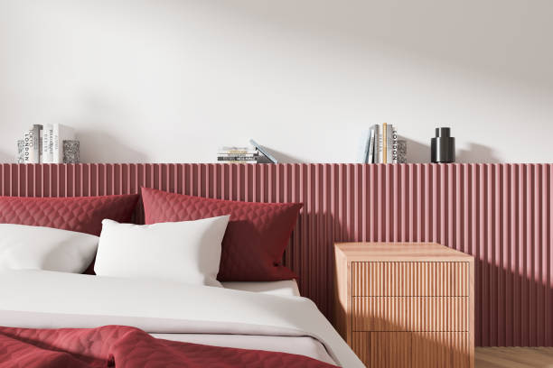 istock Modern bedroom design with red accents and ribbed pattern on the wall. 3D Rendering 2192480462