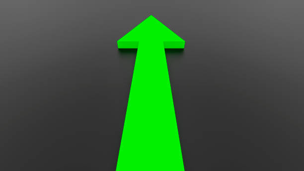 istock Green arrow seen from behind on black background. 2192480765