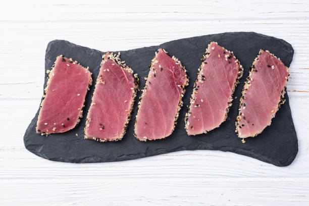 istock Sliced tuna steak with sesame photography . Top view 2192480780