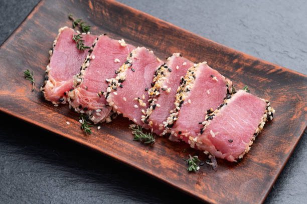 istock Sliced tuna steak with sesame photography . Top view 2192480794