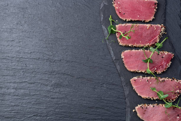 istock Sliced tuna steak with sesame photography . Top view 2192480795