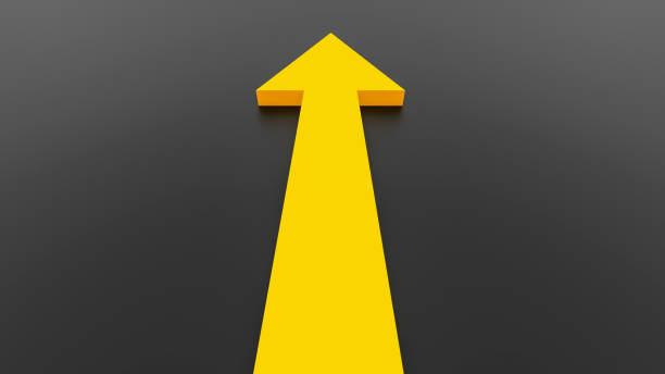 istock Yellow arrow seen from behind on black background. 2192480797