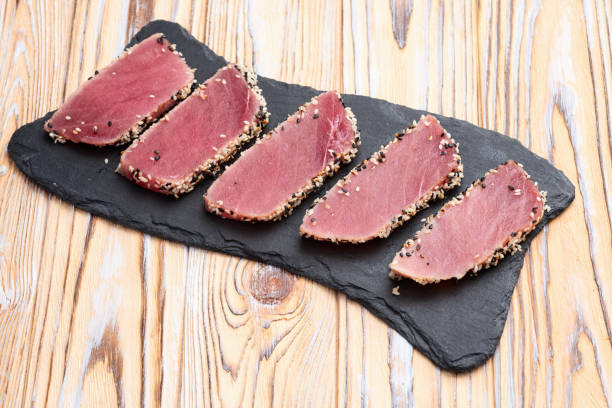 istock Sliced tuna steak with sesame photography . Top view 2192480800