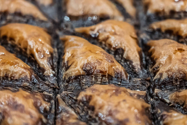 Baclava layered pastry dessert made of filo pastry, filled with chopped nuts, and sweetened with syrup or honey. Baclava or pakhlava the sweet pastries of Ottoman, Arabian, Persian and Greek cuisine