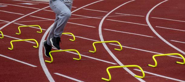 istock Athlete Training With Hurdle Drills on a Red Track Field During the Day 2192487618