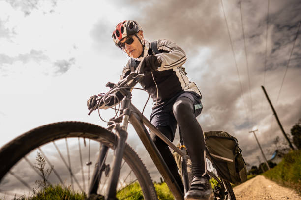 istock Senior man cycling on dirt road 2192488473
