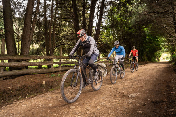 istock Friends cycling on dirt road 2192488624
