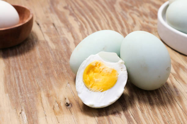 istock Close-up of Salted Duck Eggs on Wooden Table 2192490119