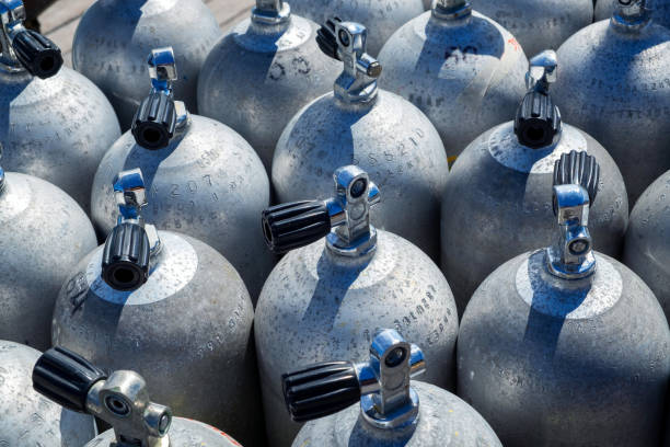 Line of diving air tanks background.