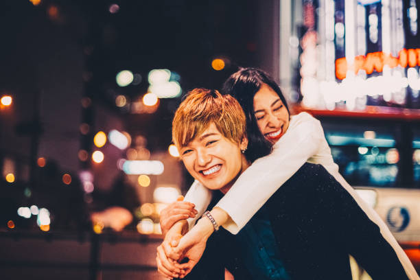 istock Young man carrying his girlfriend on piggyback 2192491921